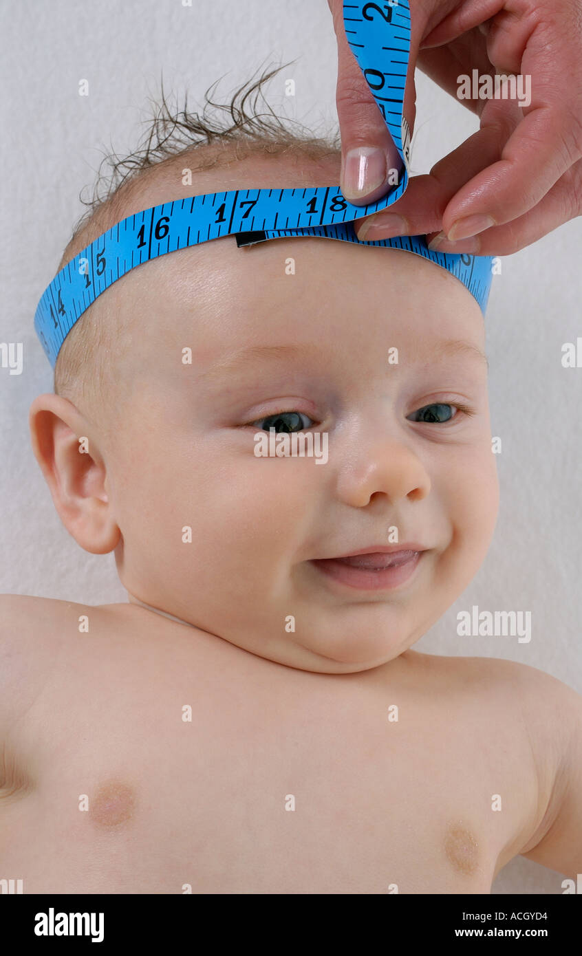 Doctor measuring the head of infant Stock Photo