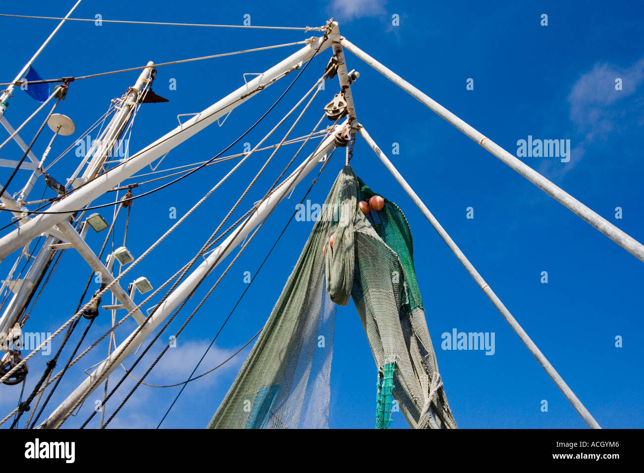 Mast and netting on a shrimp boat Stock Photo Alamy