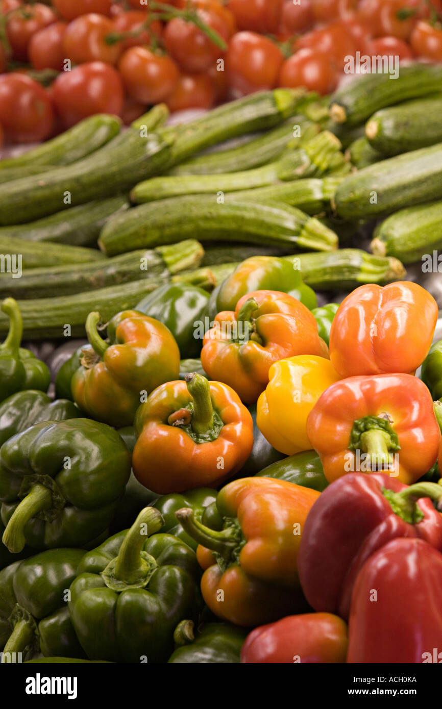 Peppers courgets and tomatoes on sale in greengrocers shop Wales UK Stock Photo