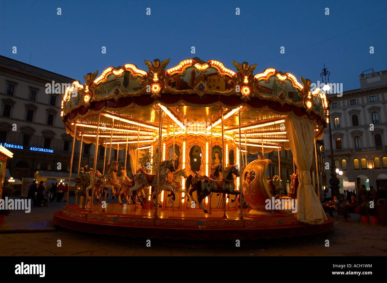 Carousel in a piazza in Florence Italy with old buildings behind it