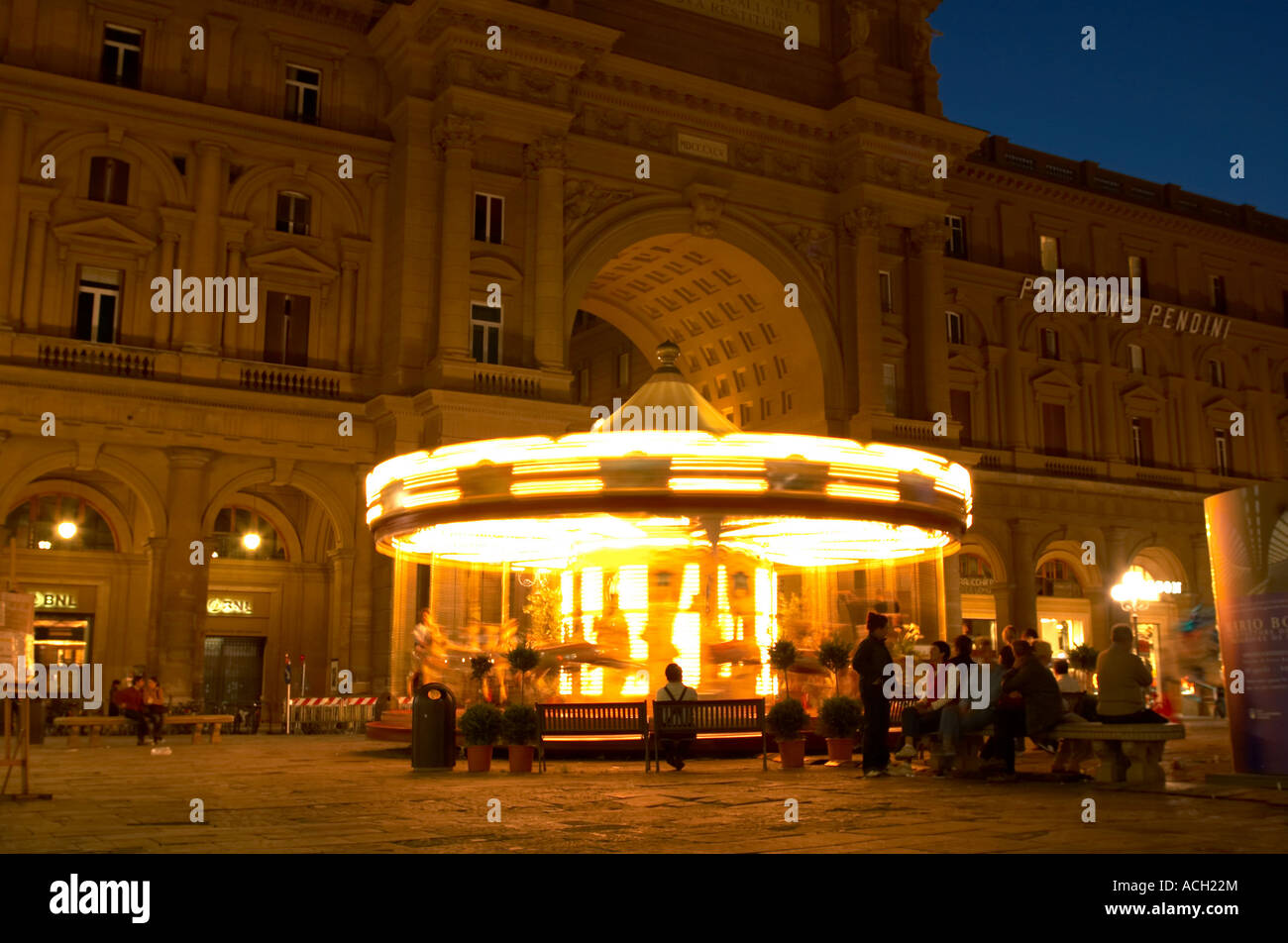 Carousel at night in a piazza in Florence Italy with dramatic