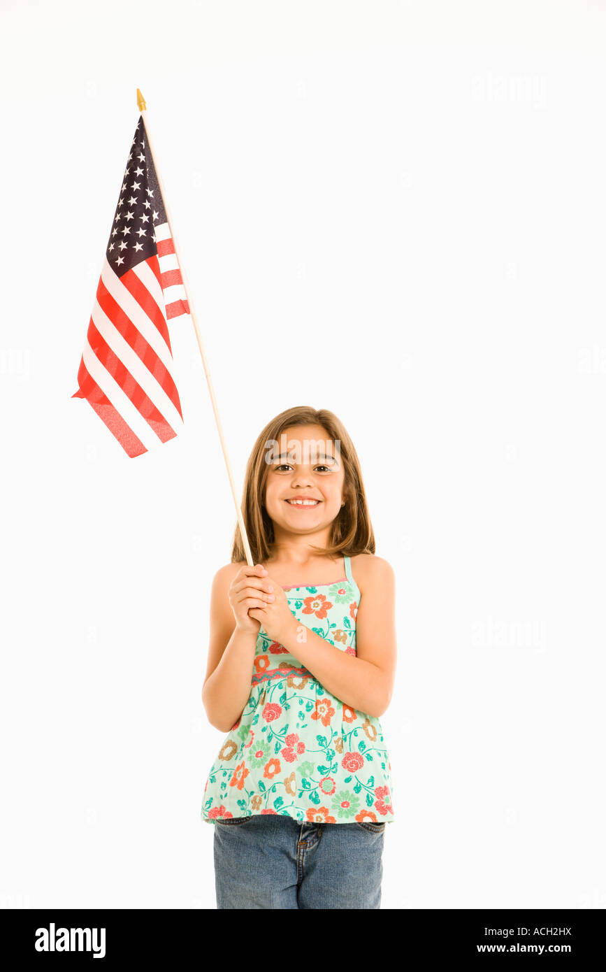 Girl holding American flag against white background Stock Photo - Alamy