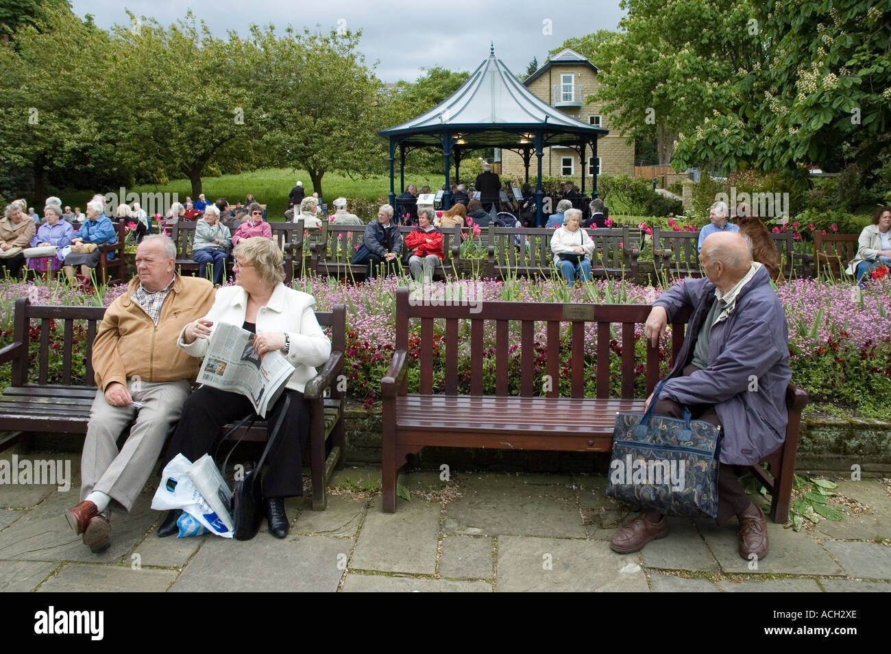 Pensioners listening to a brass band Ilkley West Yorkshire Stock Photo