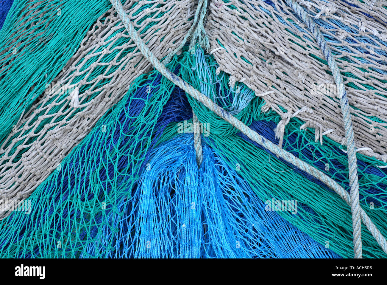 Maritime: Fishing nets and ropes in green and blue Stock Photo - Alamy