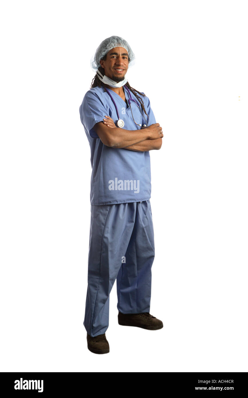 Full length portrait of young doctor in scrubs cut out on white background Stock Photo