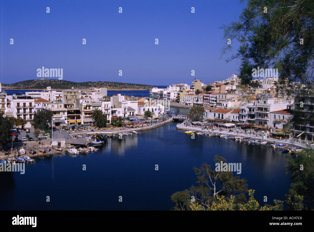 Lake Voulismeni or Bottomless Lake in foreground Agios Nikolas Crete Greece Europe Stock Photo