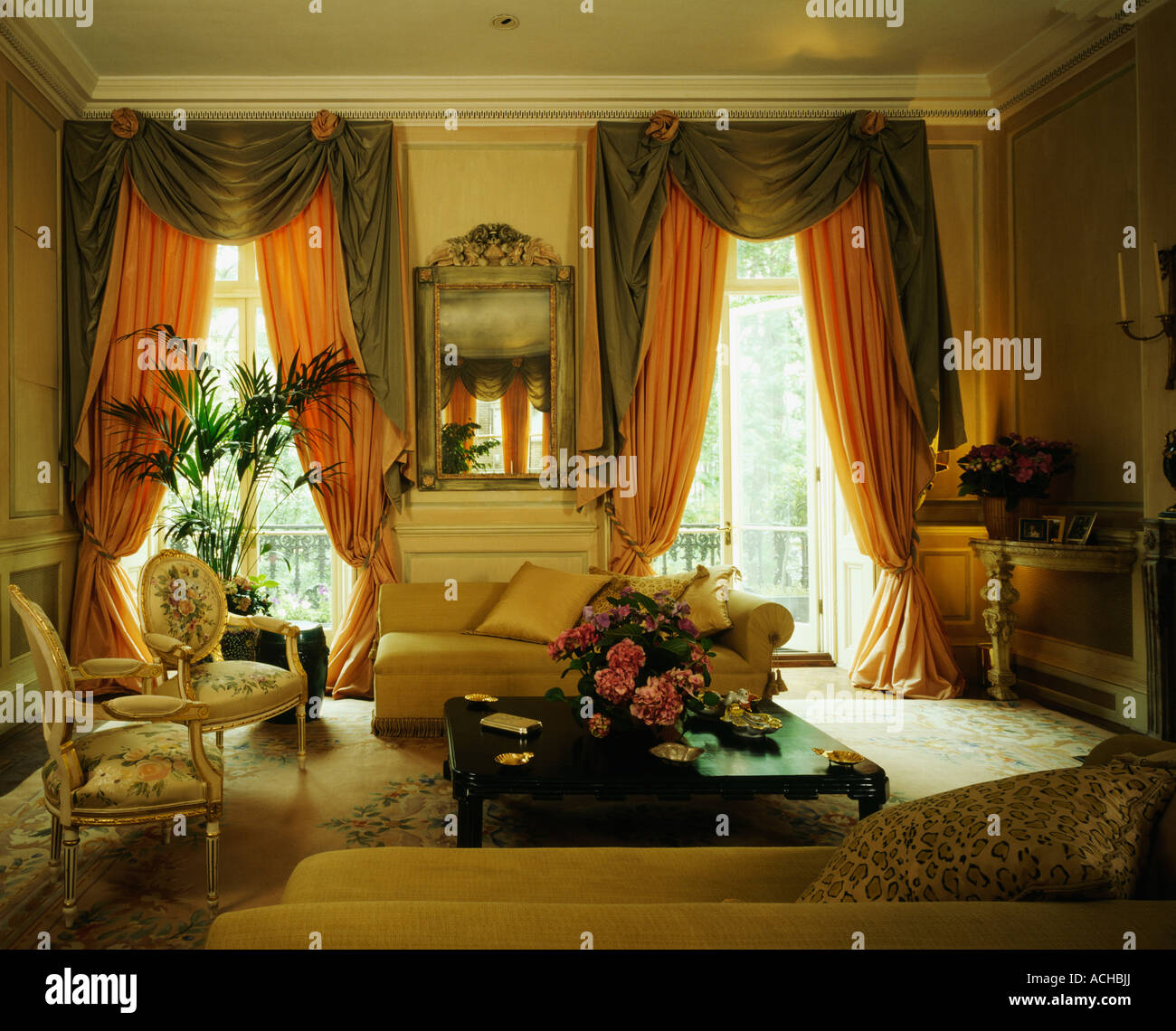 Peach Silk Drapes With Brown Tails And Swags At Tall Windows In