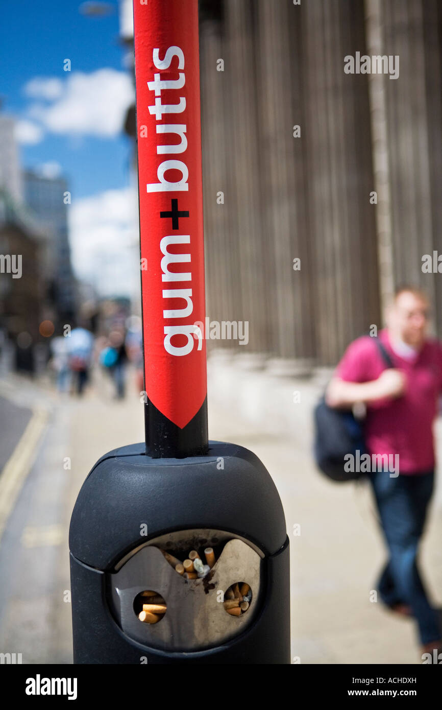 Gum and butts sign in City of London Since the smoking ban places to dispose of cigarettes have appeared across the city Stock Photo