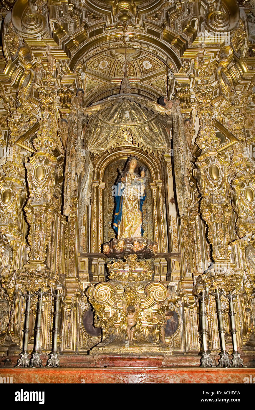 Virgin and child statue in German gothic altarpiece in Chapel of the Virgin Antigua in the cathedral Granada Spain Stock Photo