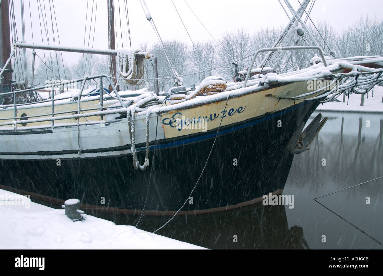 Boat on Dutch canal in the winter Stock Photo