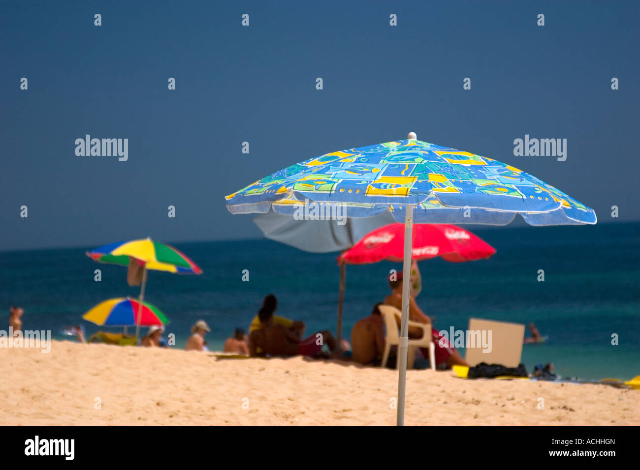 Parasol on a beach in Carvoeiro, Algarve, Portugal Stock Photo - Alamy
