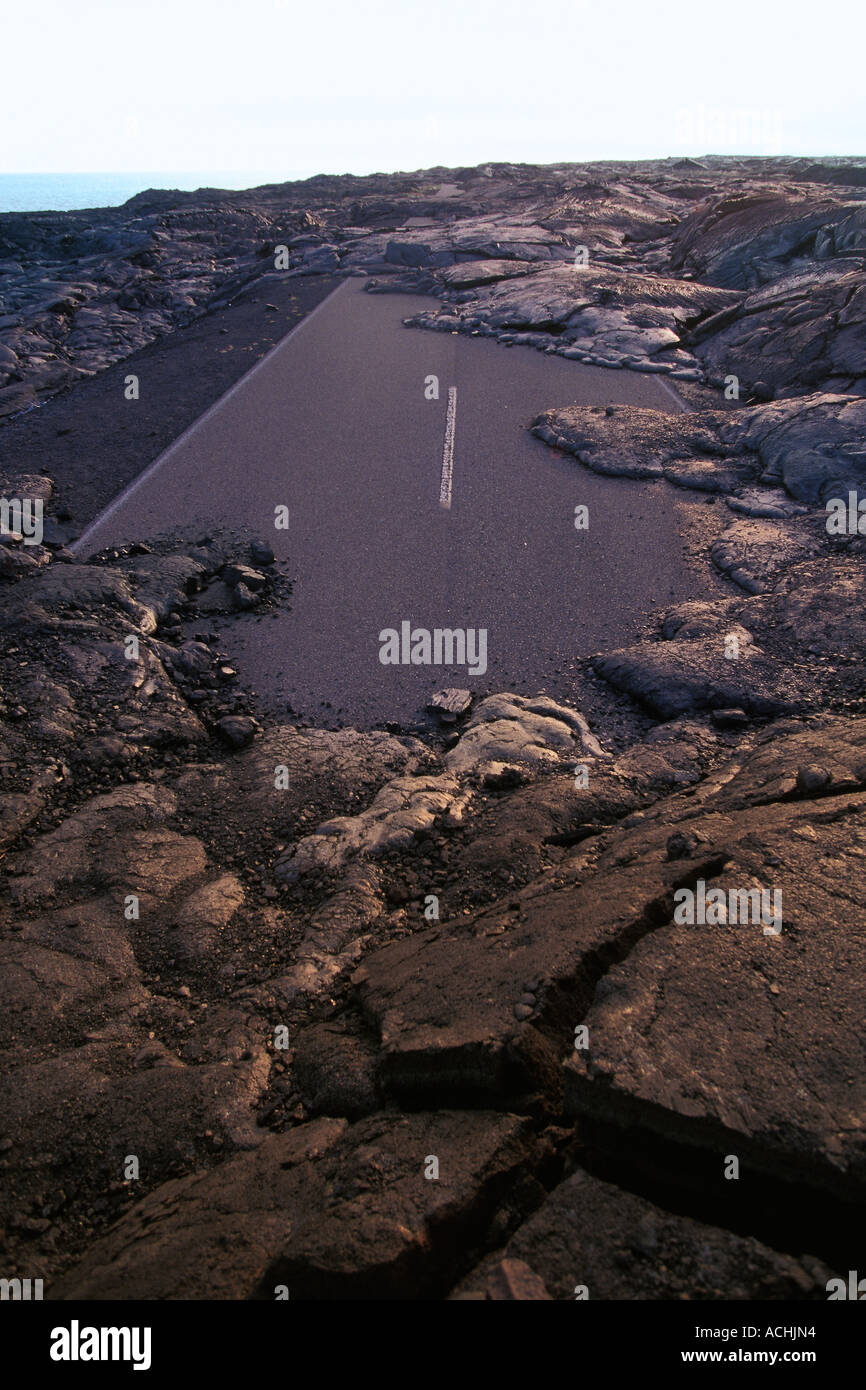 Asphalt paved Chain of Craters Road covered by lava flow from Kilauea ...