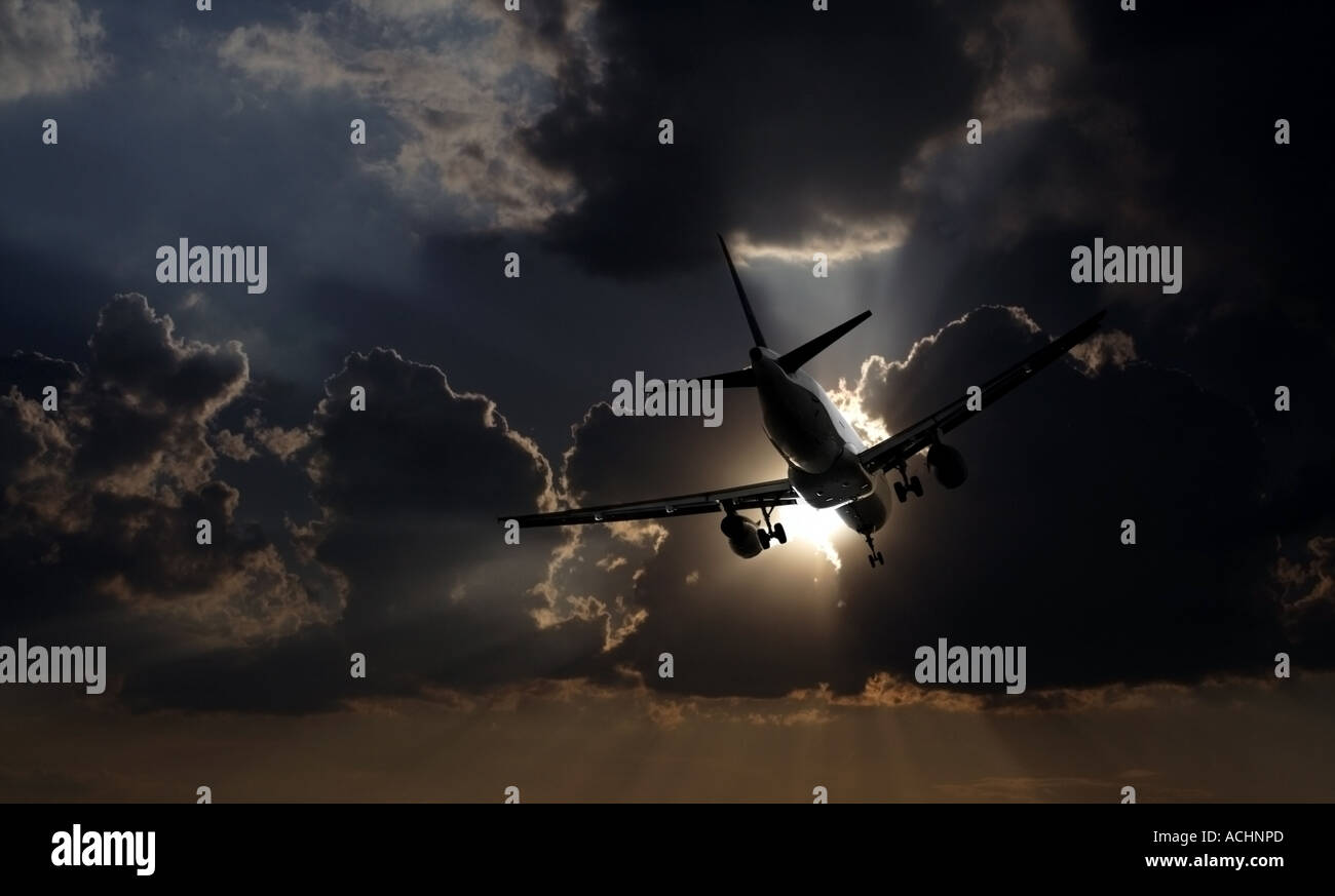 Airplane flying towards the sun and stormy clouds Stock Photo - Alamy