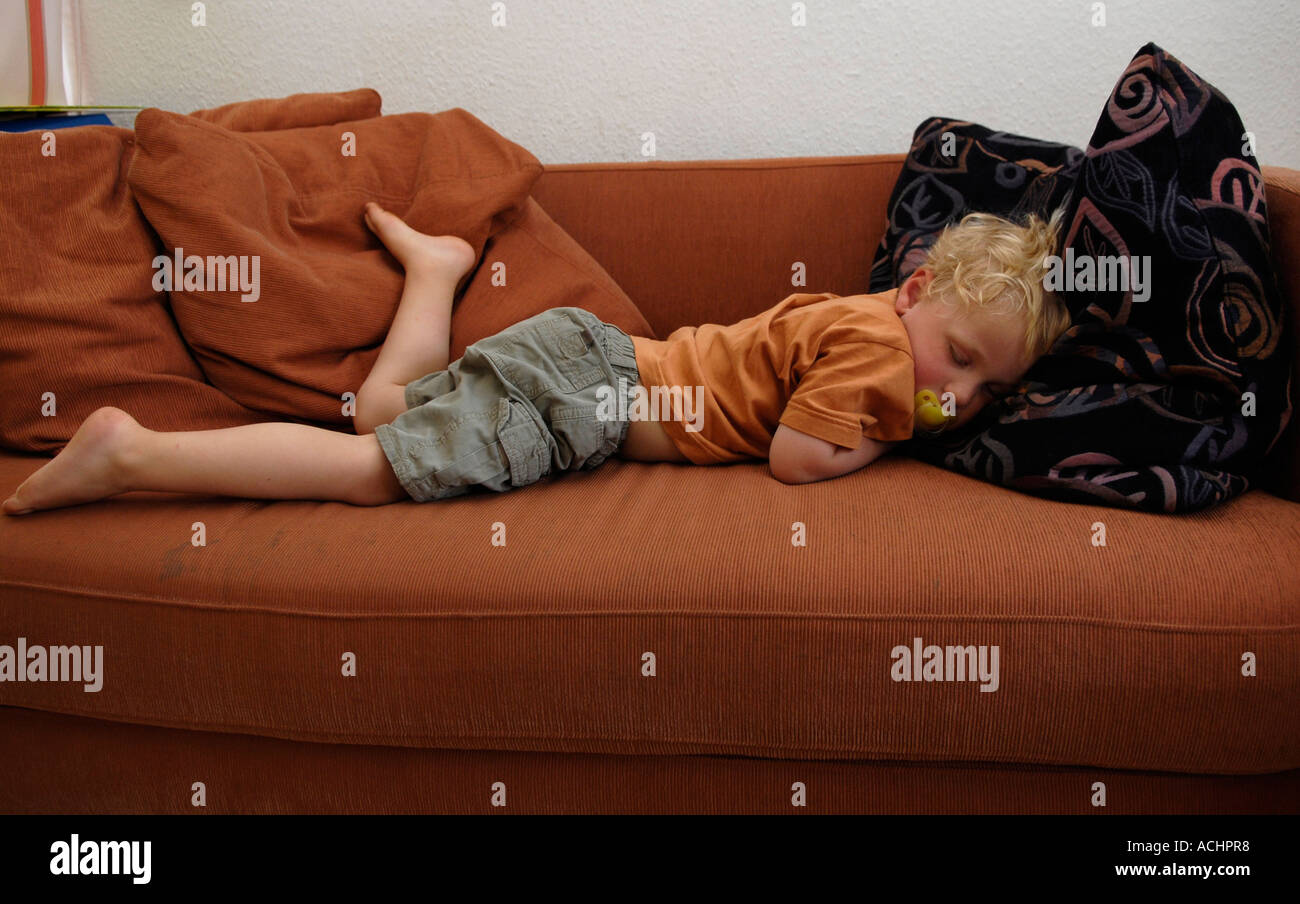 Little boy sleeps on sofa Stock Photo