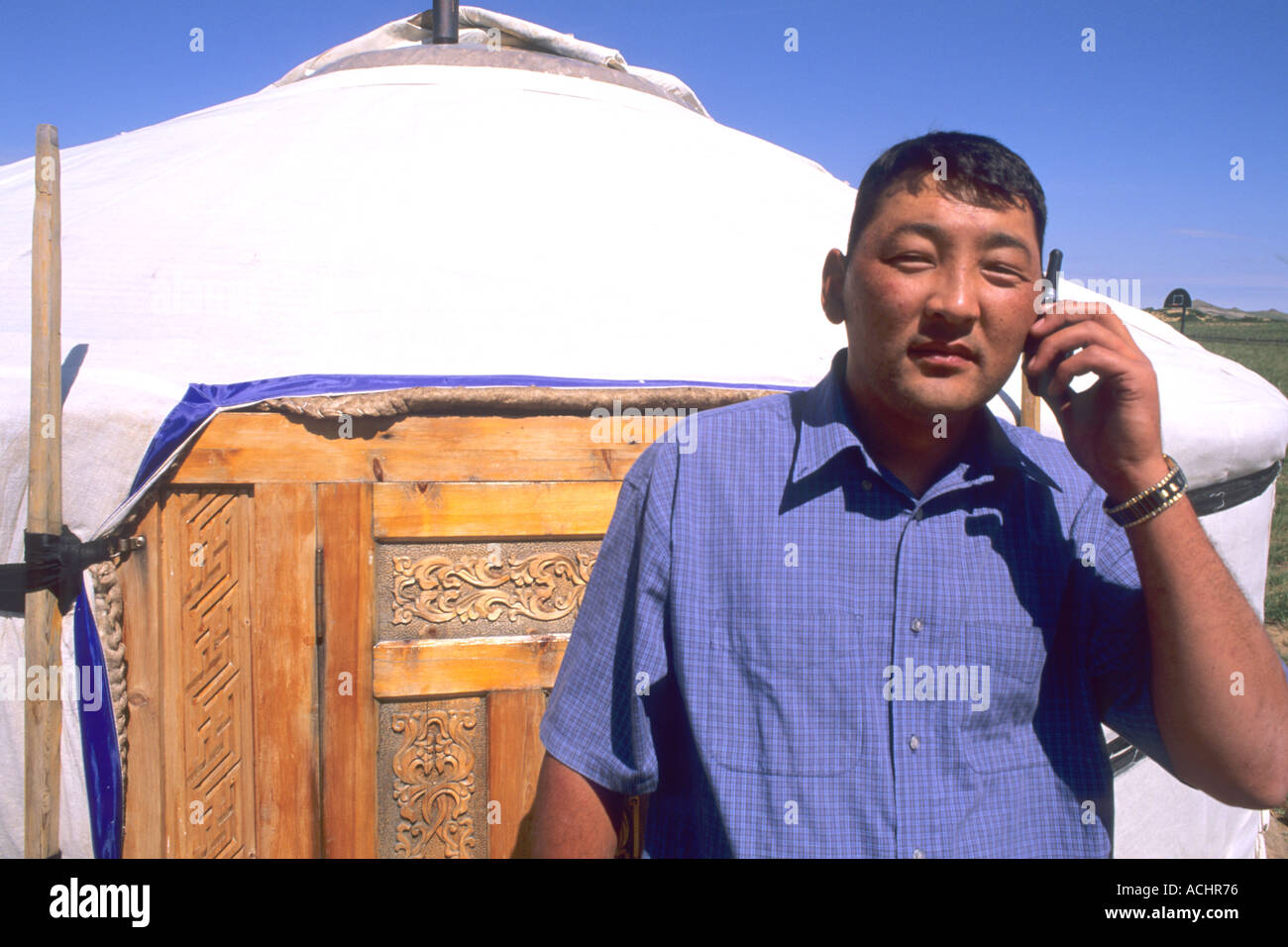 Nomadic Villager next to Ger on Cell Phone in Mongolia Stock Photo - Alamy