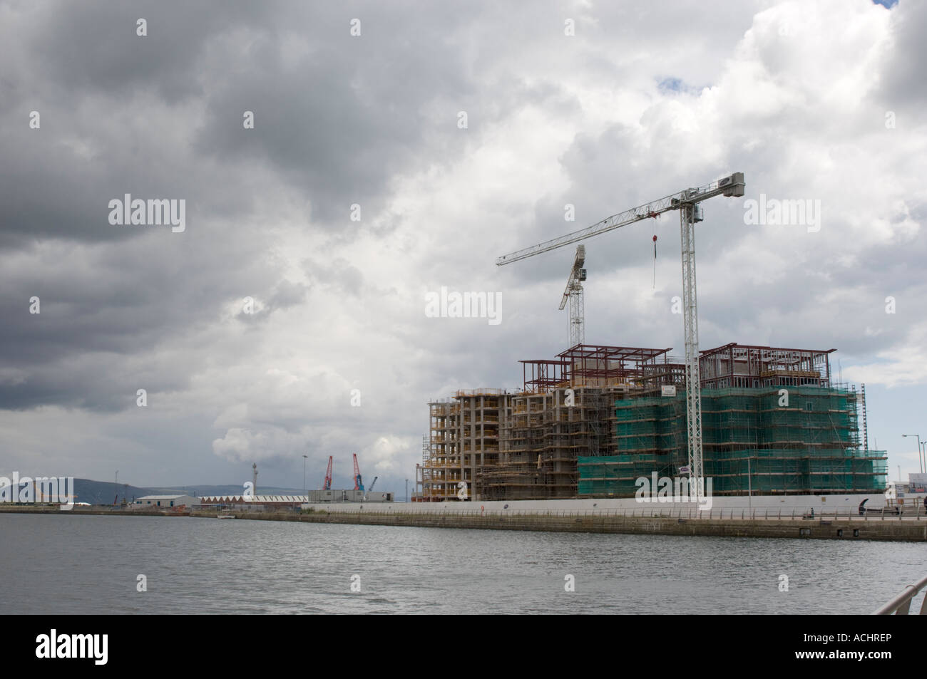 New flats being built Swansea marina SA1 development against a brooding
