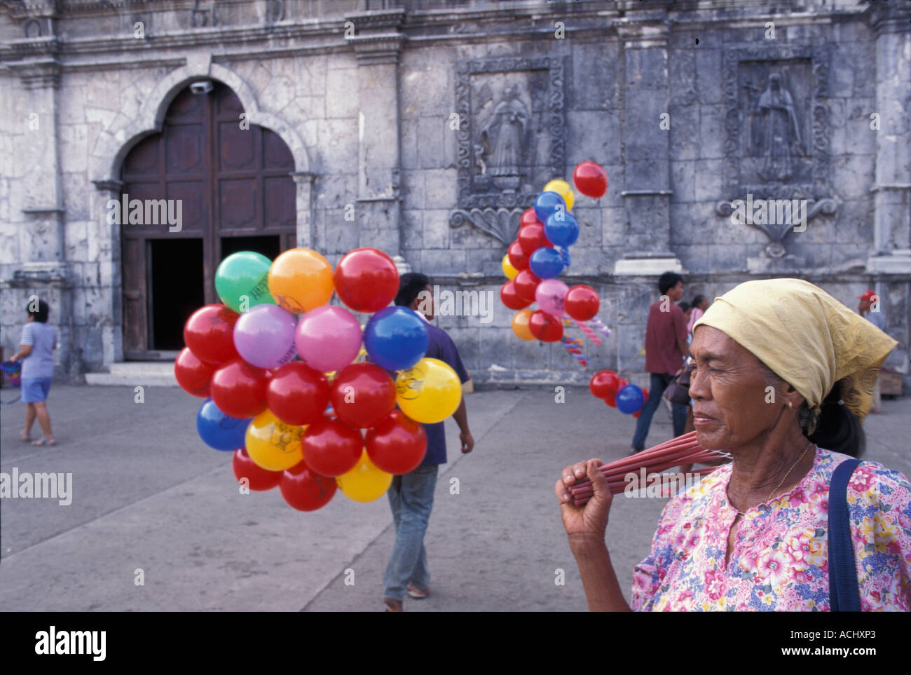Philippines Cebu Island Woman sells incense outside Cebu s Basilica del
