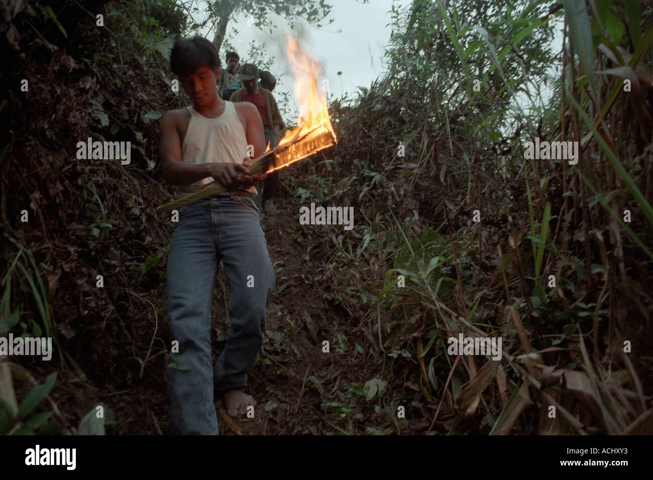 Asia Philippines Luzon Island Banaue Mourners carry torches at family matriarch s funeral