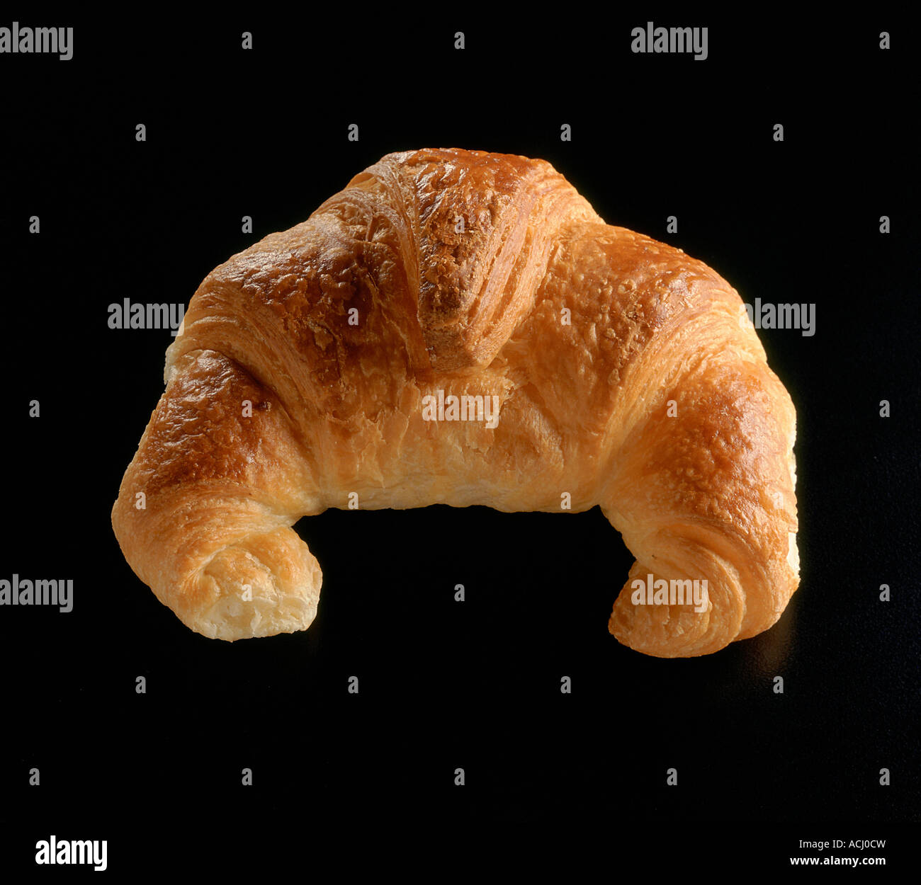 Croissant on black background Stock Photo - Alamy
