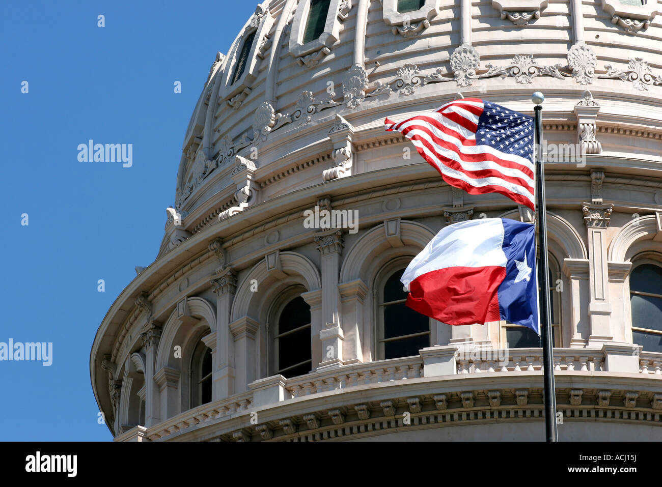 Flags flying on the Texas State Capitol building Stock Photo