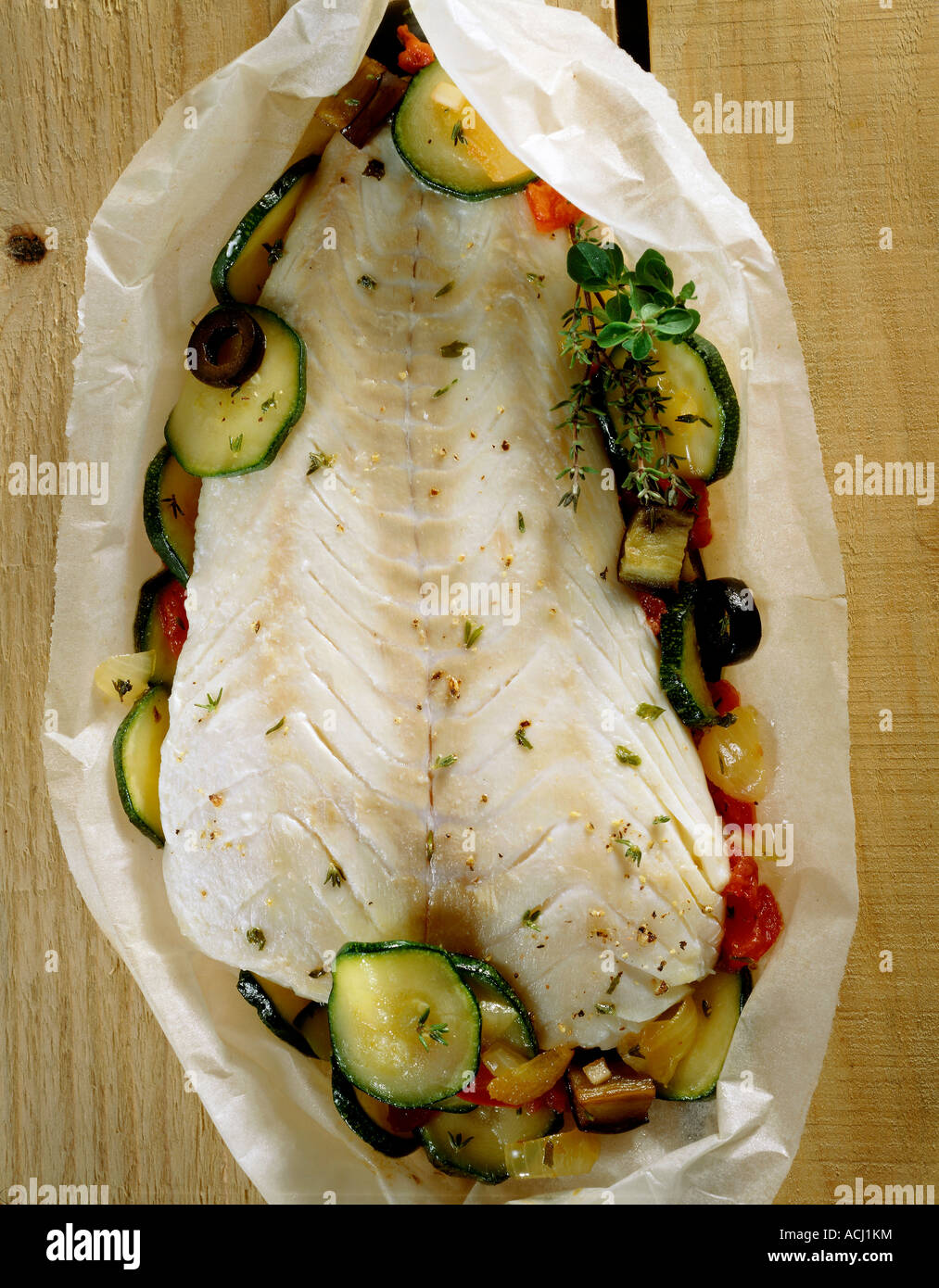Fish and vegetables in curl paper Stock Photo Alamy