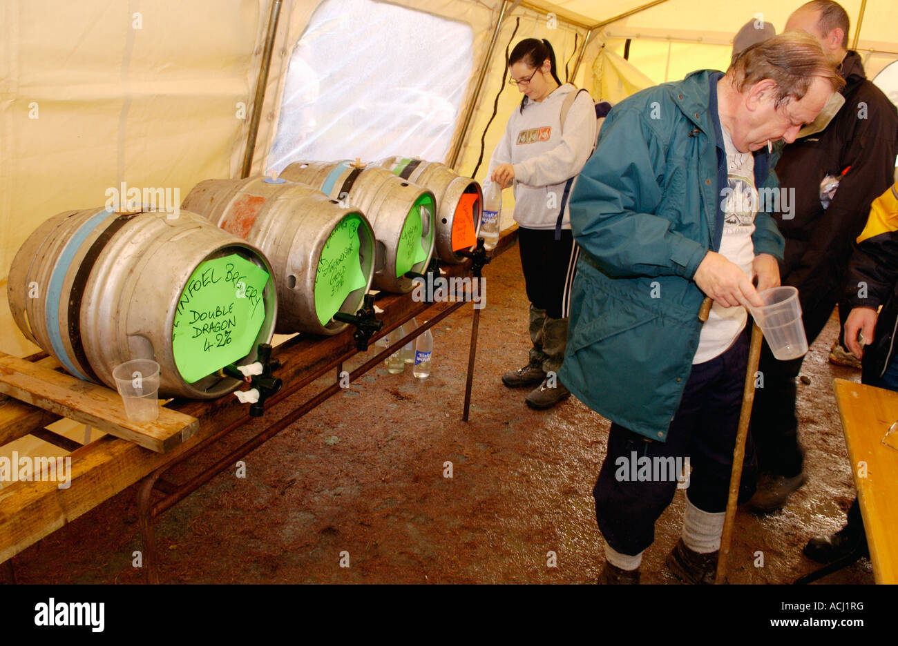 Walkers taking part in the Real Ale Ramble Walking Festival stop for a ...