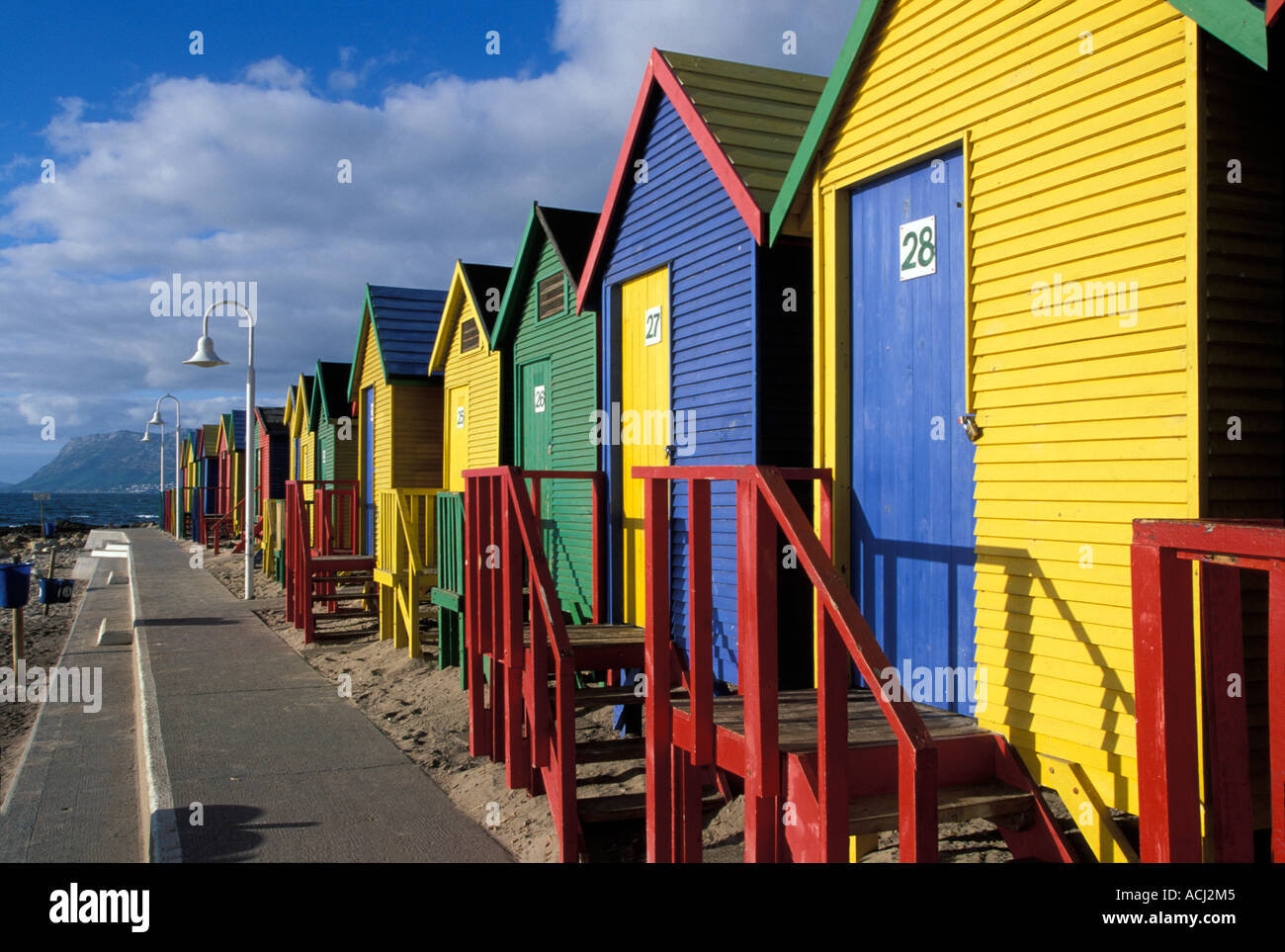 South Africa Cape Town Brightly painted bath houses along beach in