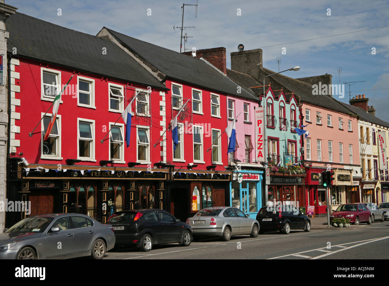 Coloured shopfronts in Carrickmacross Main Street County Monaghan Ireland Stock Photo