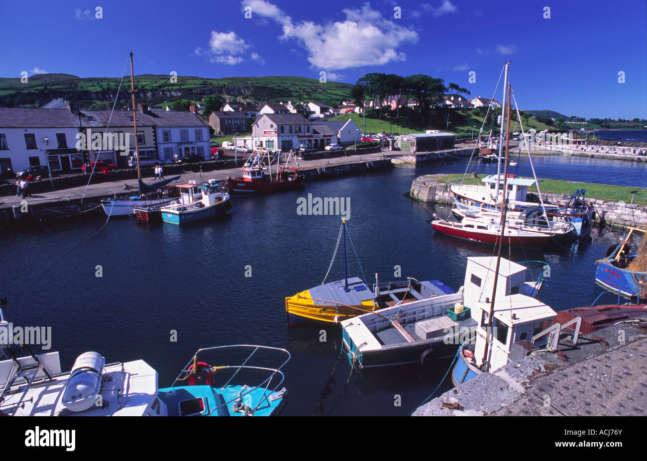 Summer fishing boats in Carnlough Harbour, Glens of Antrim, County Antrim, Northern Ireland, UK. Stock Photo