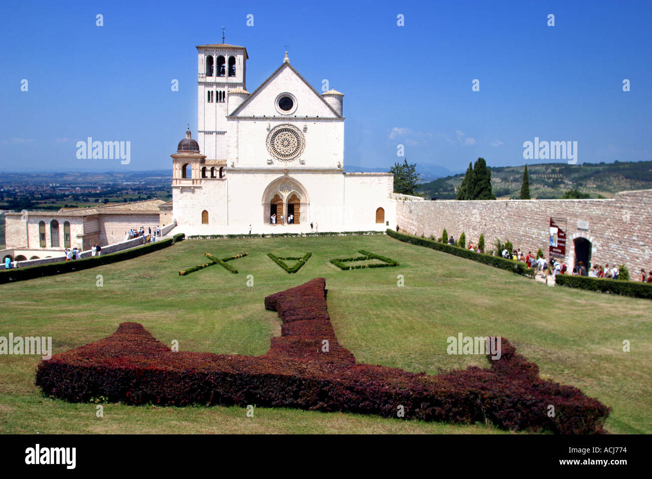 Basilica of Saint Francis and TAU symbol Assisi Umbria Italy Stock Photo