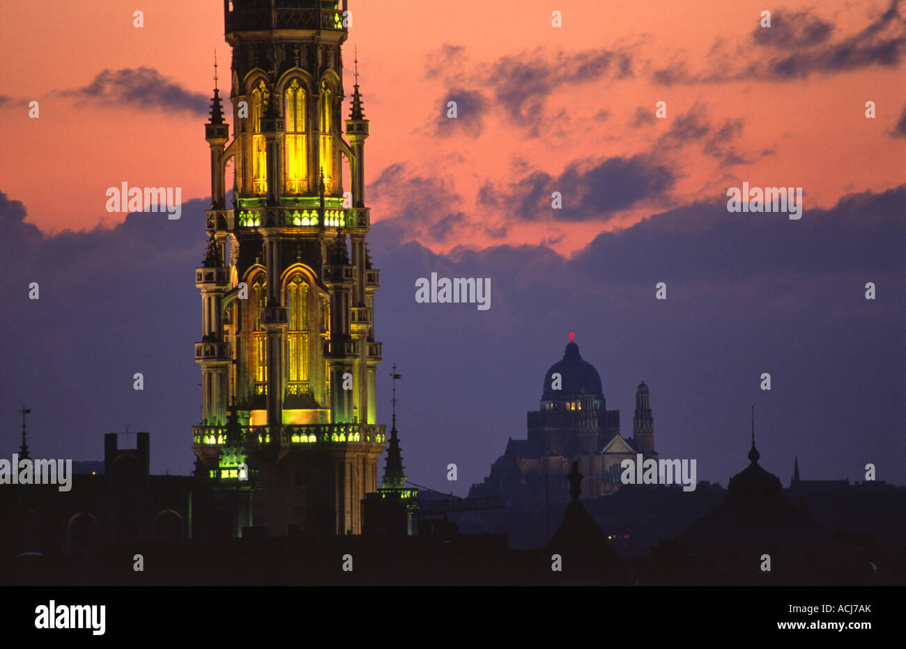 The ornate tower of Brussels Town Hall dominates the city skyline at dusk. Brussels, Belgium. Stock Photo
