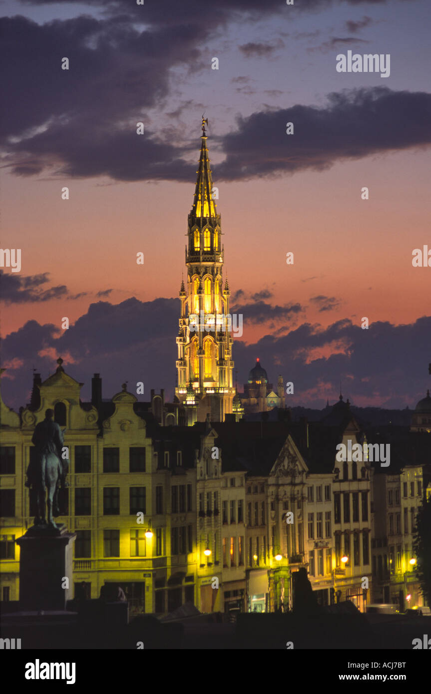 The ornate tower of Brussels Town Hall dominates the city skyline at dusk. Brussels, Belgium. Stock Photo