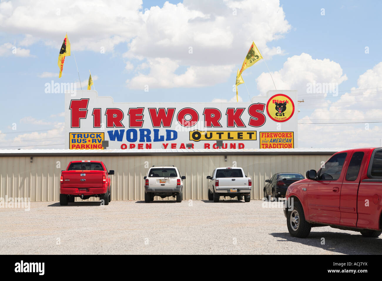 Fireworks store outlet with pickup trucks in parking lot Route 66