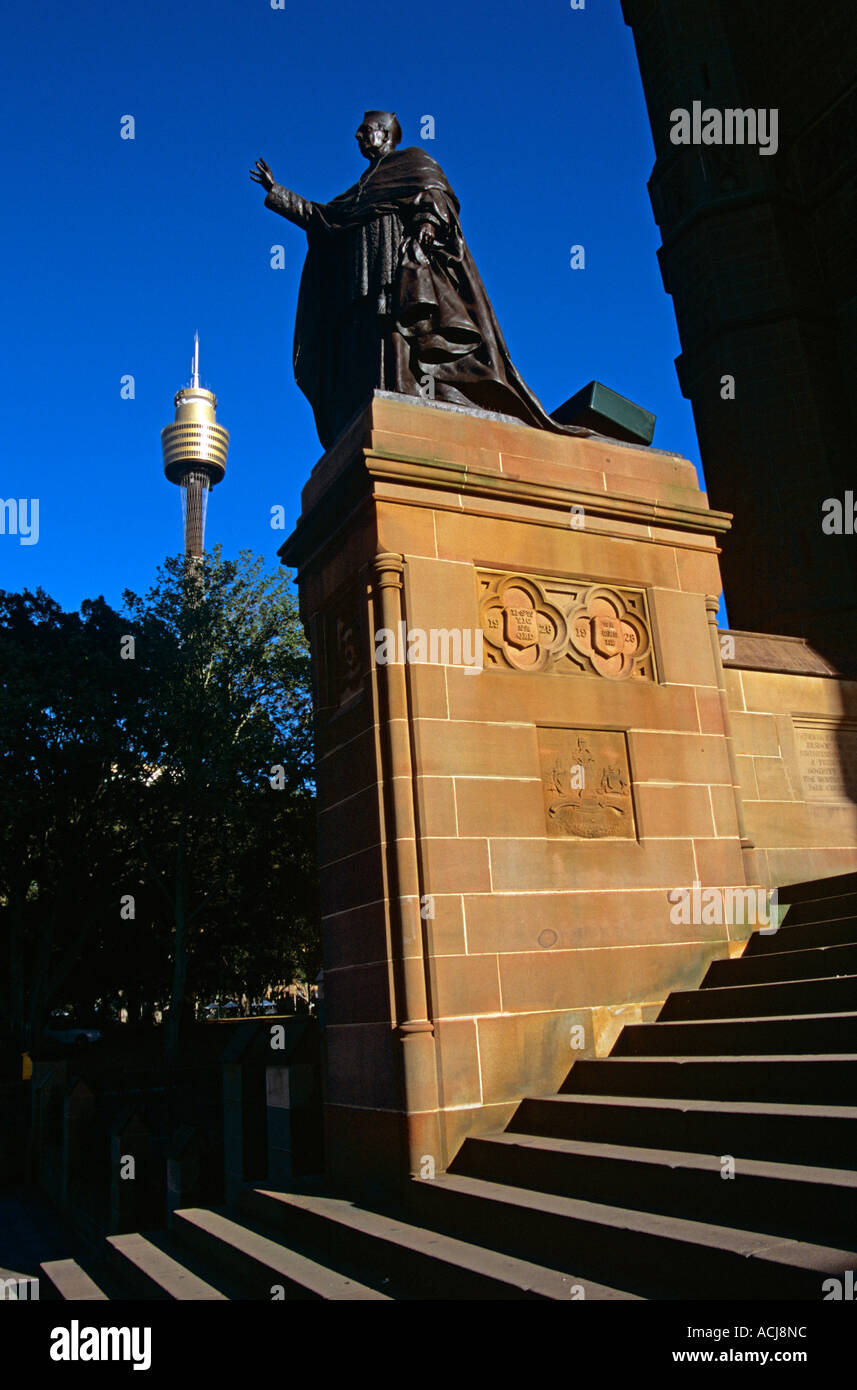 Statue on plinth, Saint Mary's Cathedral and AMP Centrepoint Tower, Sydney, New South Wales, Australia. Evening light Stock Photo