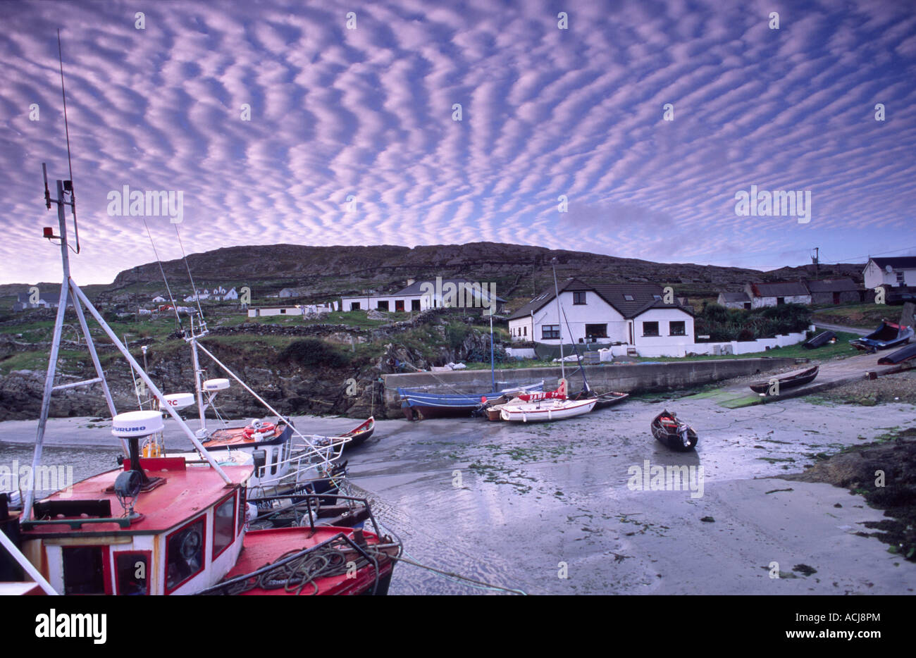 Mackerel sky over Inishturk harbour, Inishturk Island, County Mayo, Ireland. Stock Photo