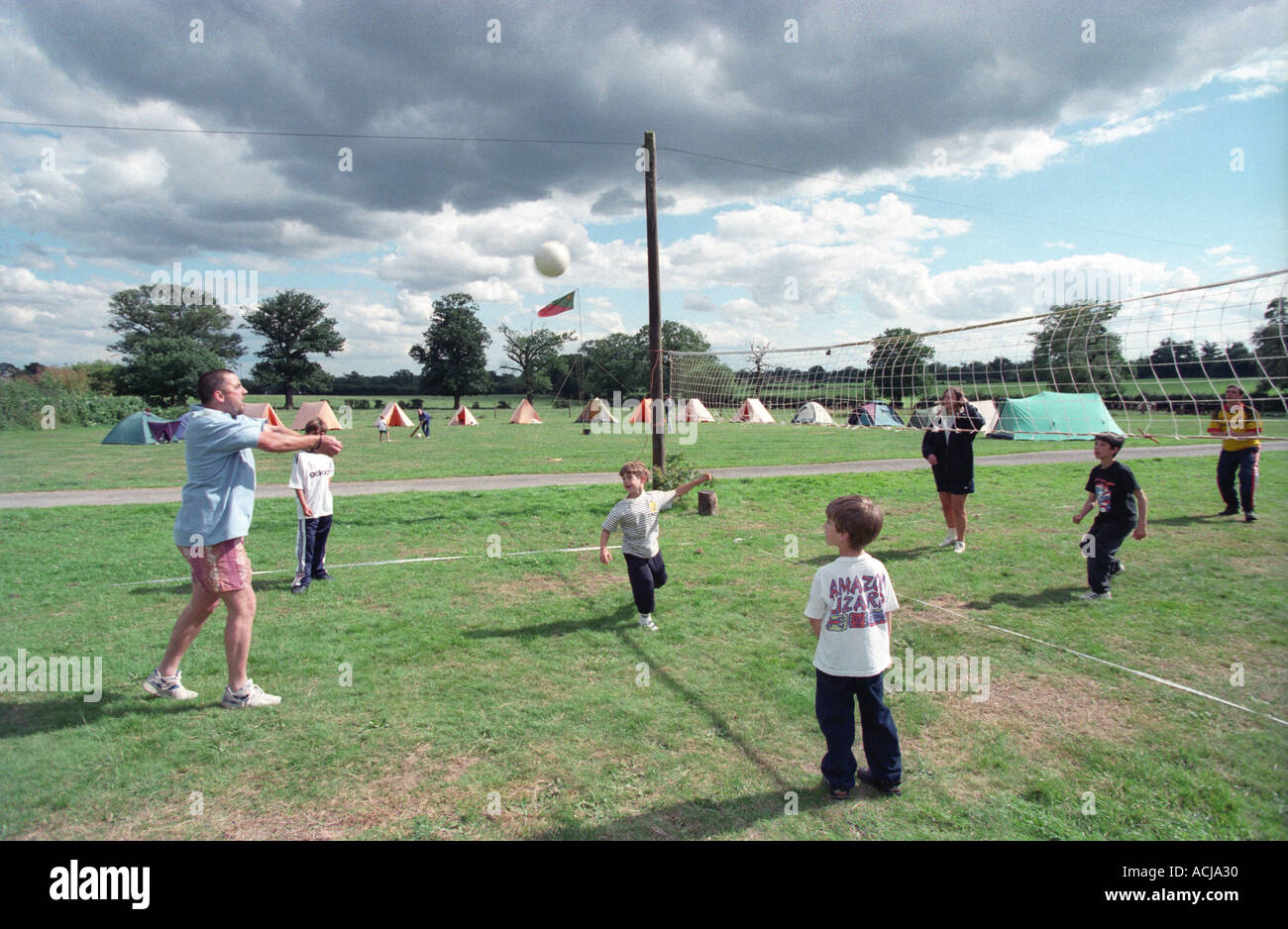 People on camp site playing basketball, Middlesex, UK Stock Photo Alamy