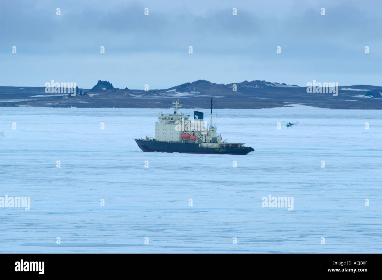 Helicopter coming into land on Russian icebreaker Kapitan Dranitsyn in Frans Josef land High Arctic Russia Stock Photo