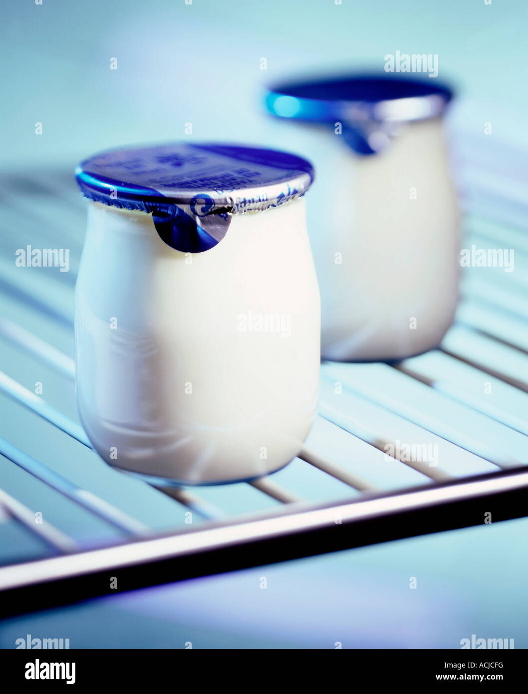 Yoghurt pots in refrigerator Stock Photo Alamy