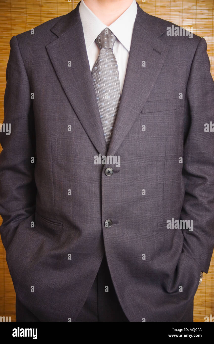 Man in suit, no head Stock Photo