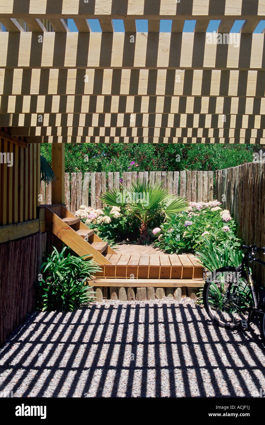 Terrace beams of a penthouse making shadow wooden stairs ATV against