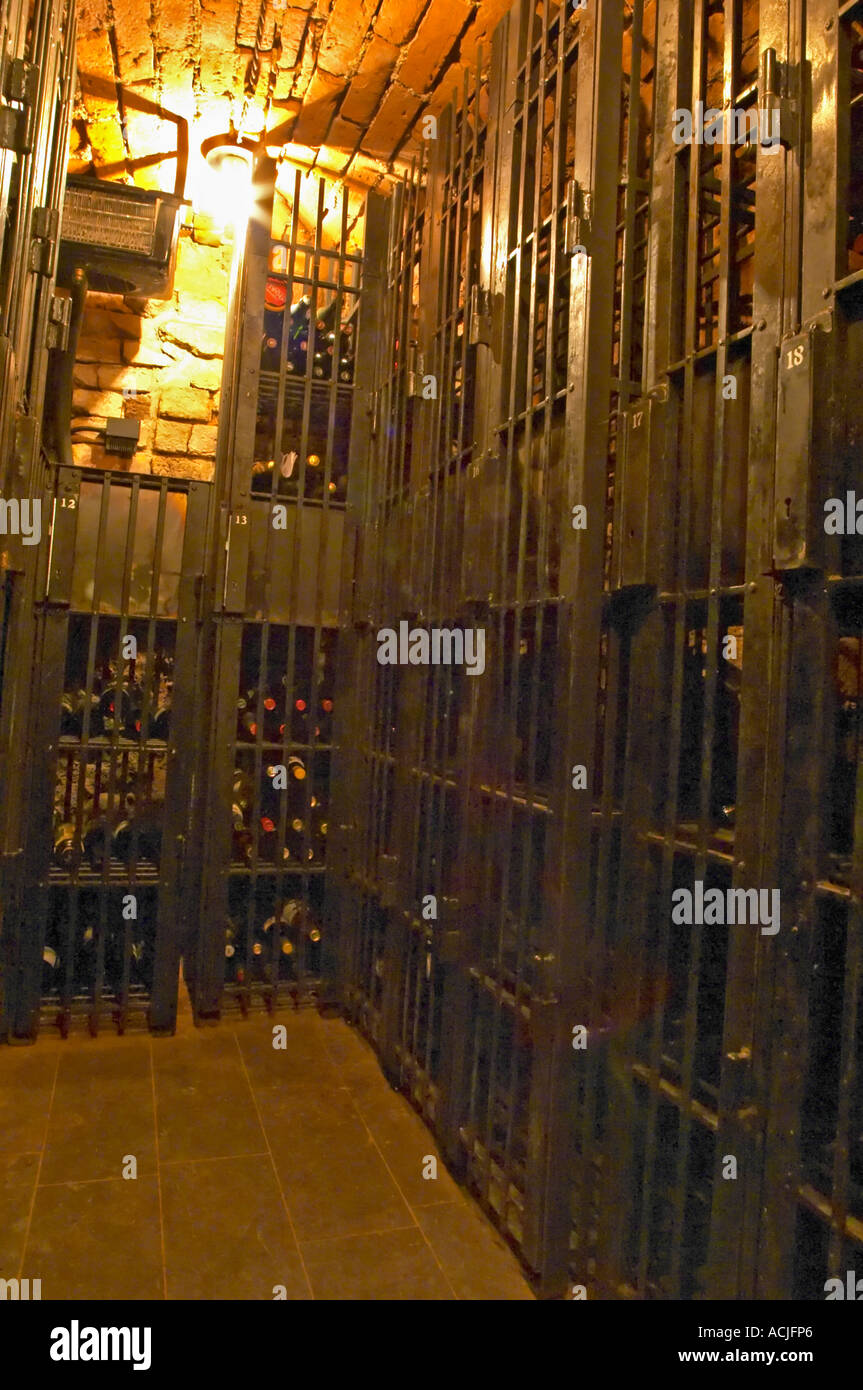 A wine cellar with precious bottles guarded behind iron bars. Stockholm ...
