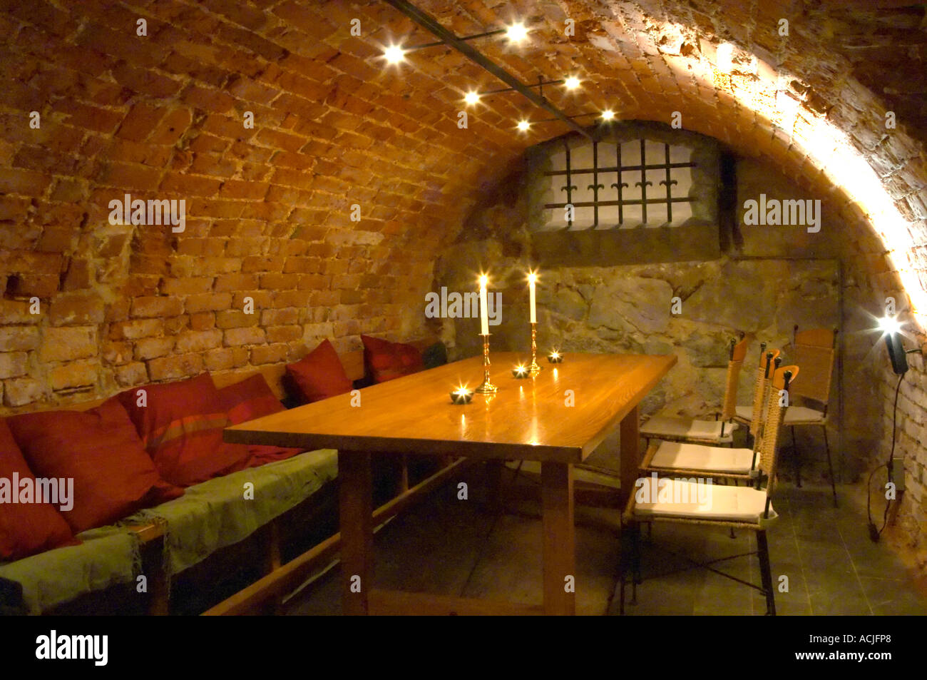 A basement storage room converted to a vaulted wine tasting room ...