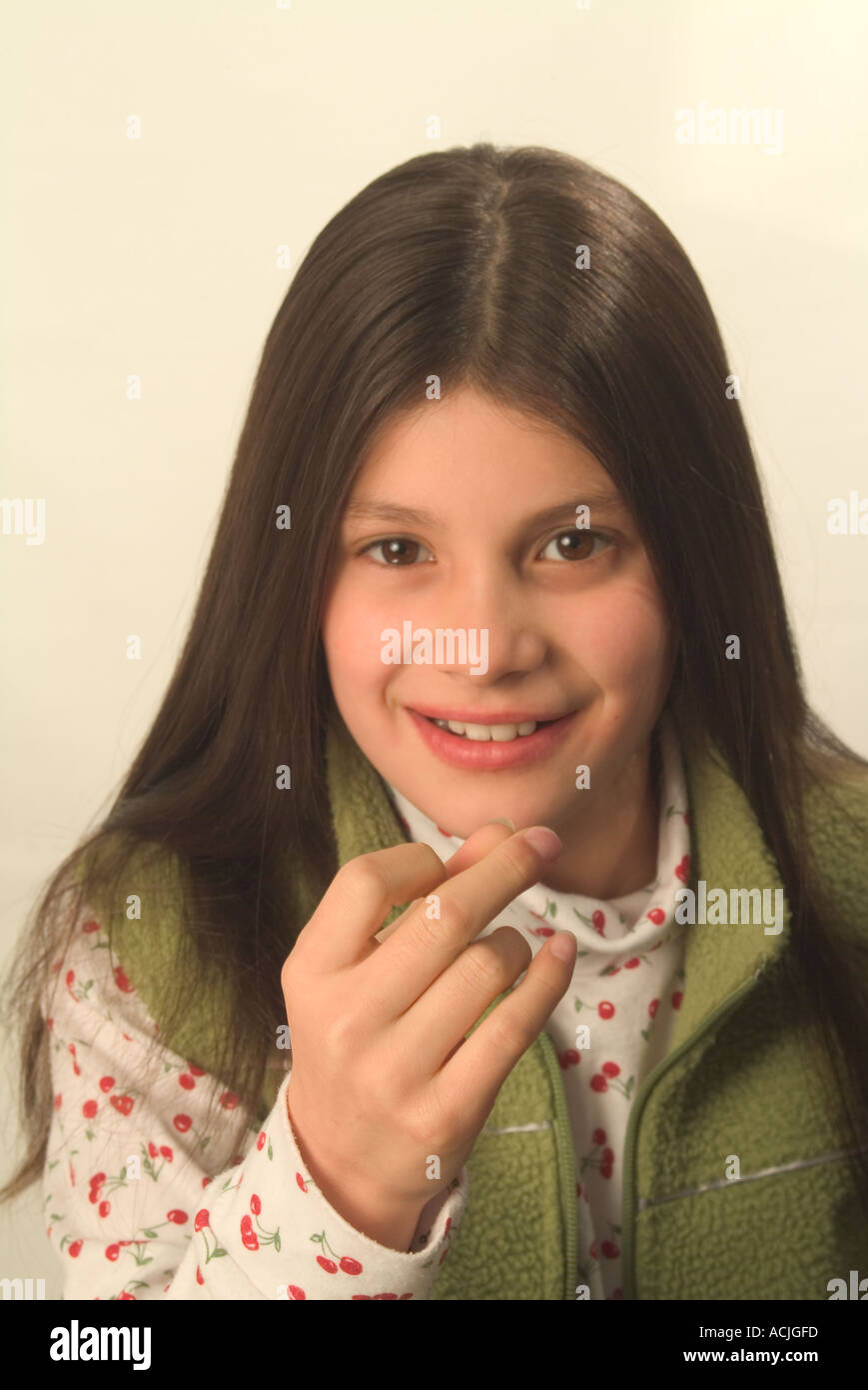 9 year old girl snapping her fingers Stock Photo