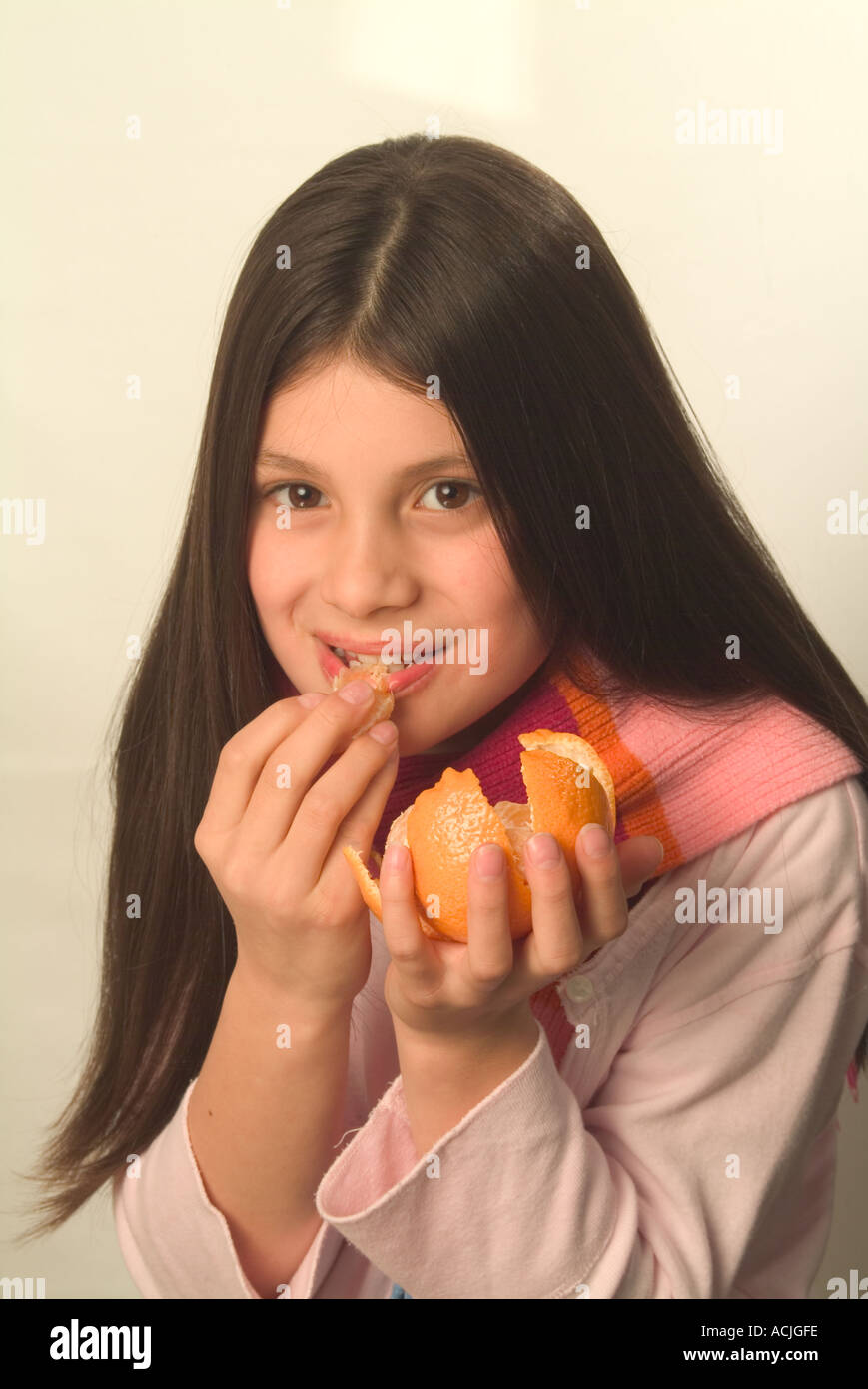 9 Year Old Girl Eating A Mandarin Orange Stock Photo Alamy 9-year-old-girl-eating-a-mandarin-orange-stock-photo-alamy