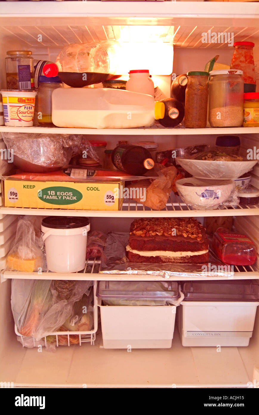 Overfilled untidy refrigerator Stock Photo