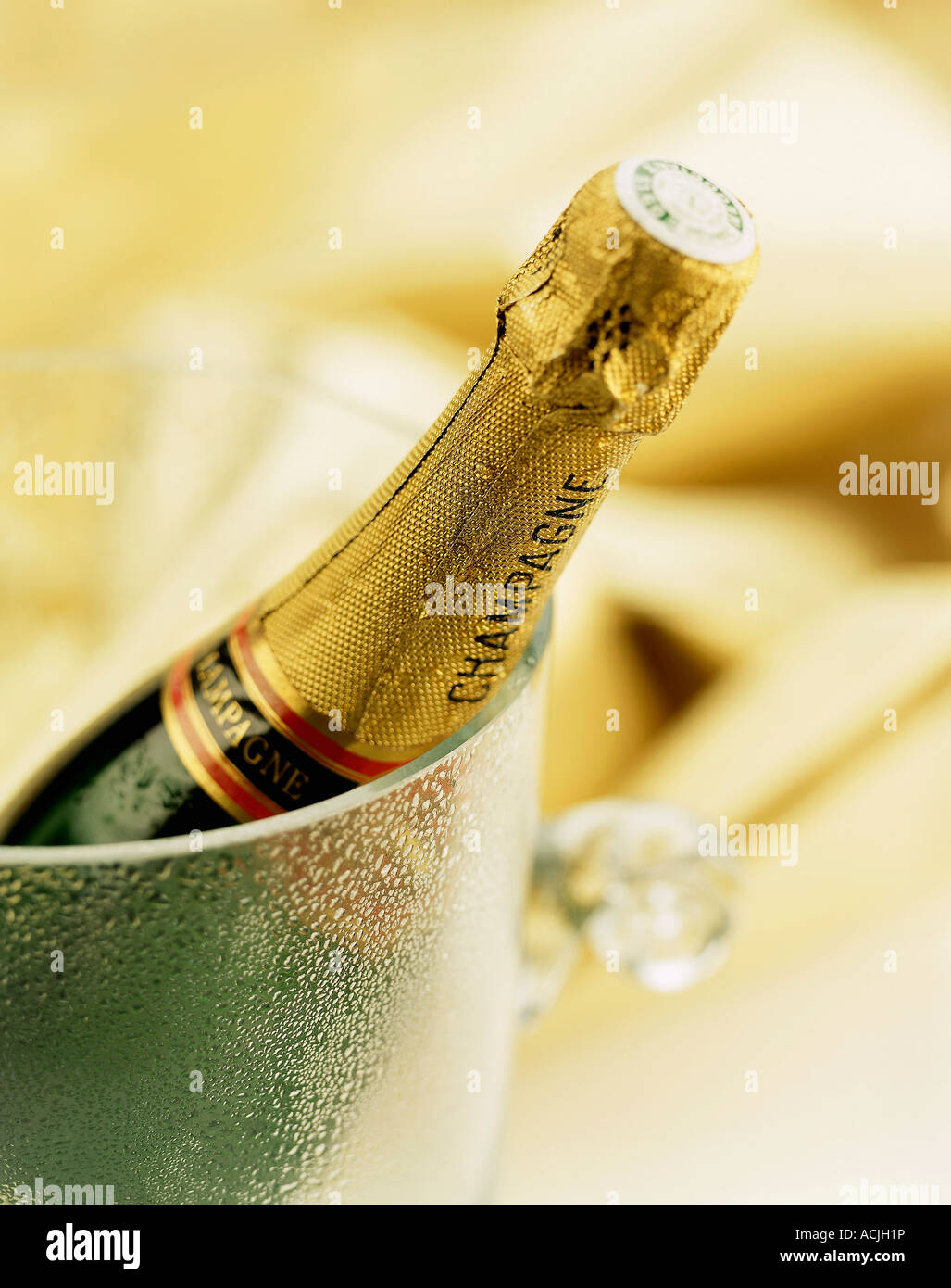 Bottle of champagne in bucket condensing water Stock Photo Alamy