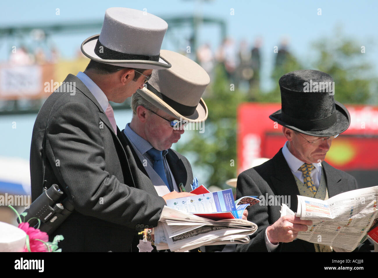 studying form on race day Stock Photo