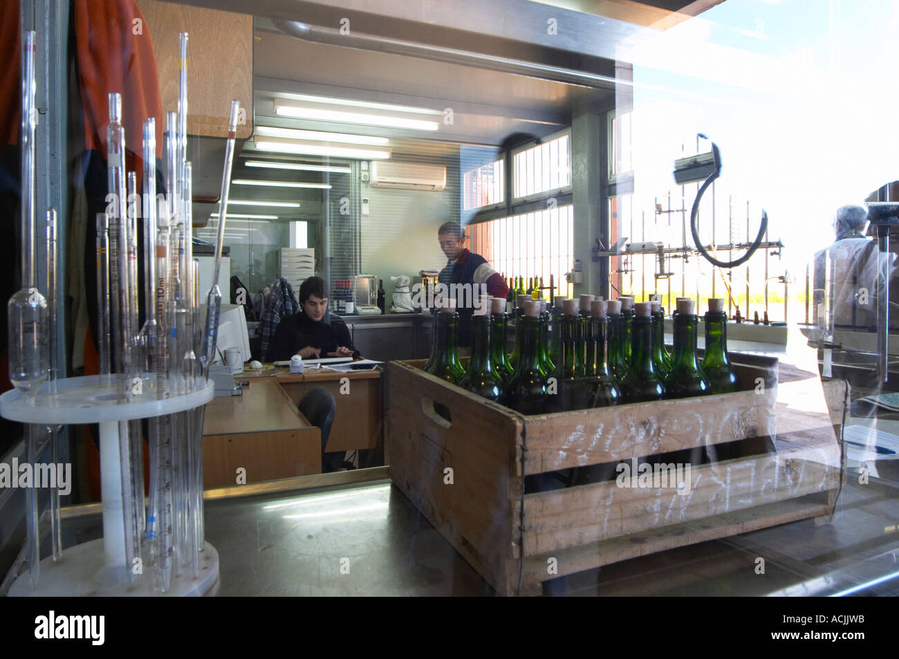 The winery laboratory seen through a window with equipment to analyse
