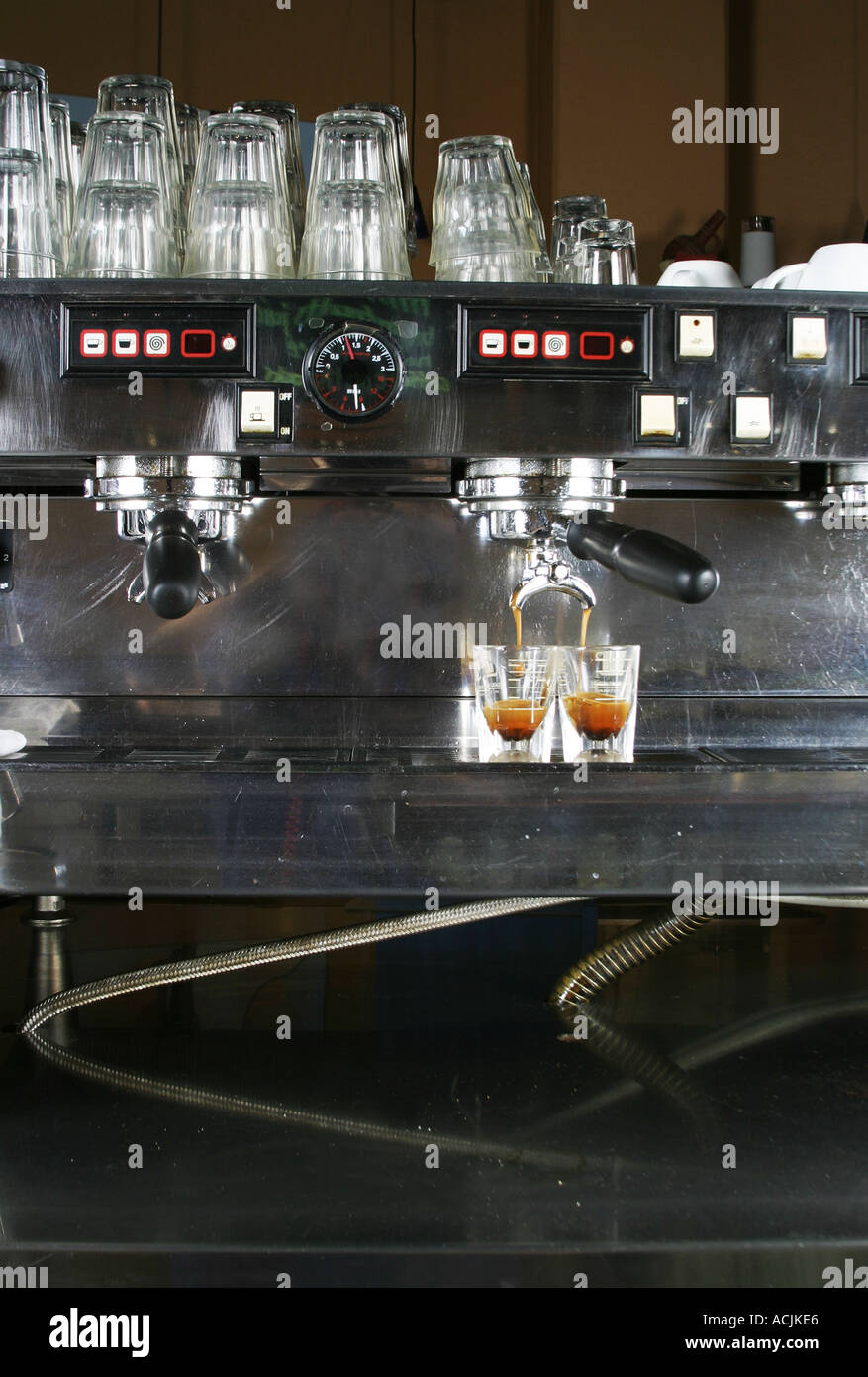Two shots of espresso being drawn from a professional espresso machine Stock Photo Alamy