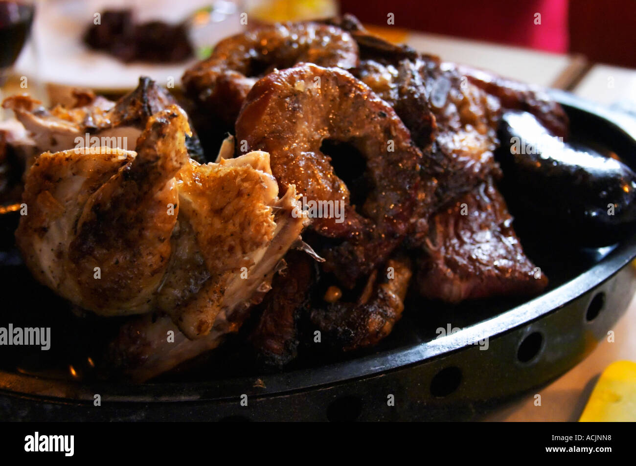 A dish of typical Uruguay barbecue with chicken, pork, beef, sausages